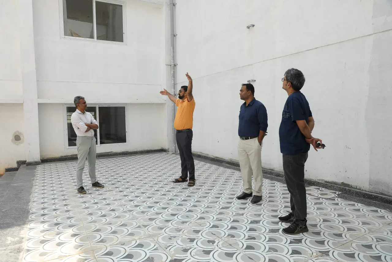 Team on the terrace of the new academic block at Bachenahatti, Magadi Road, October 2026