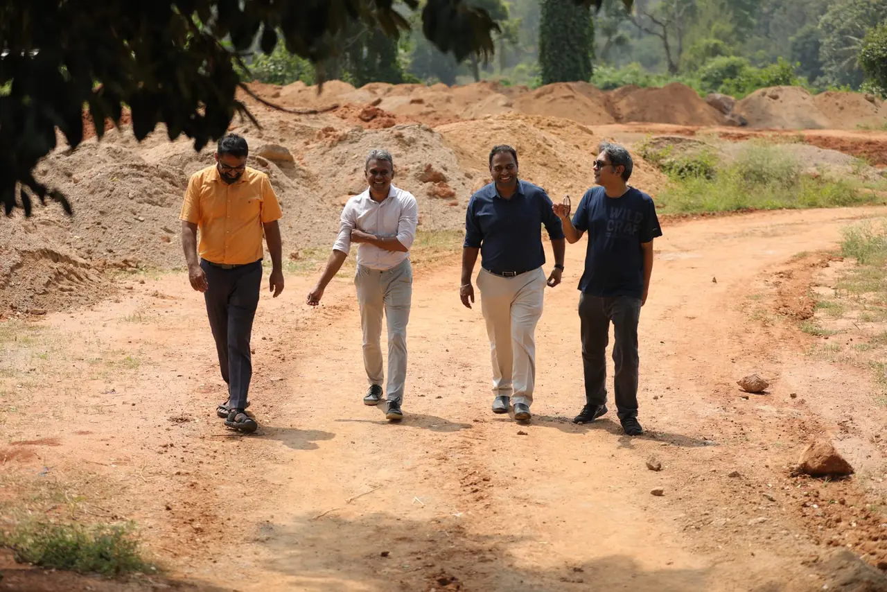 Dr Varun Murthy and the RIMA team walking the earth road through the Bachenahatti site