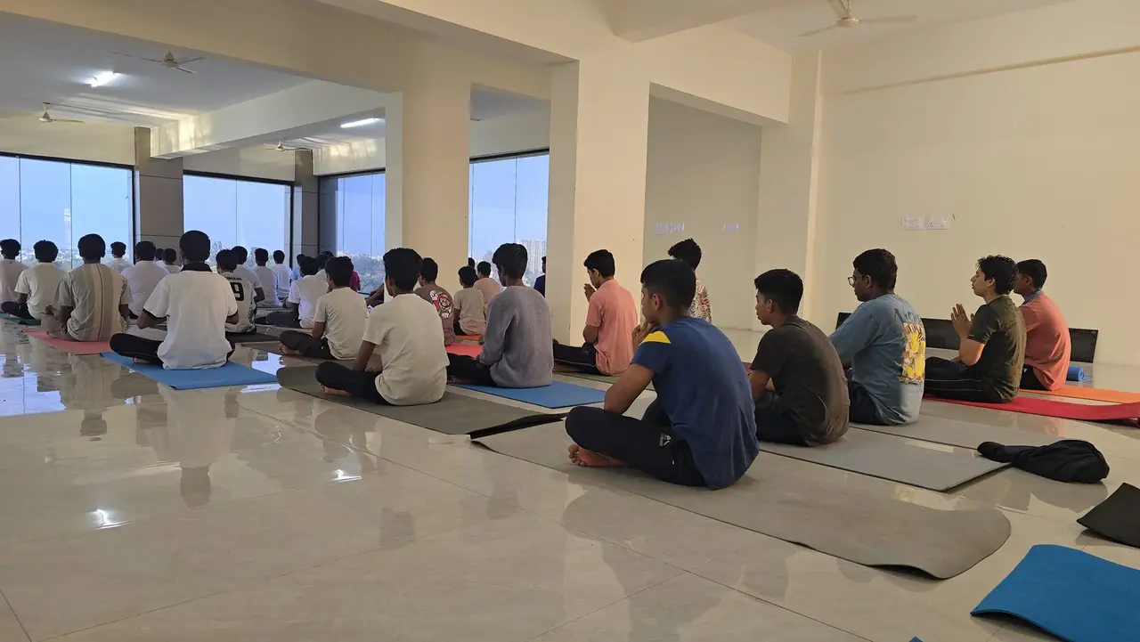 Students meditating at dawn in the hall at a RIMA campus