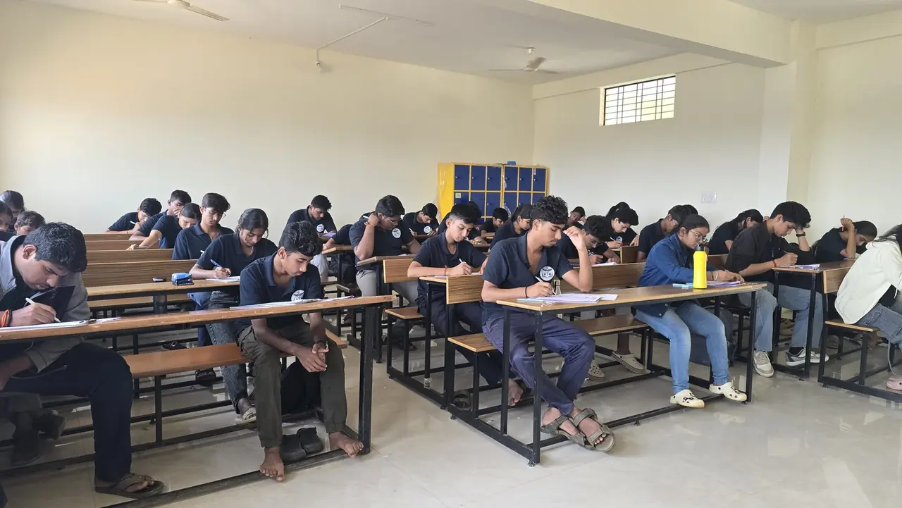 Long-term NEET students working silently in rows during a self-study block